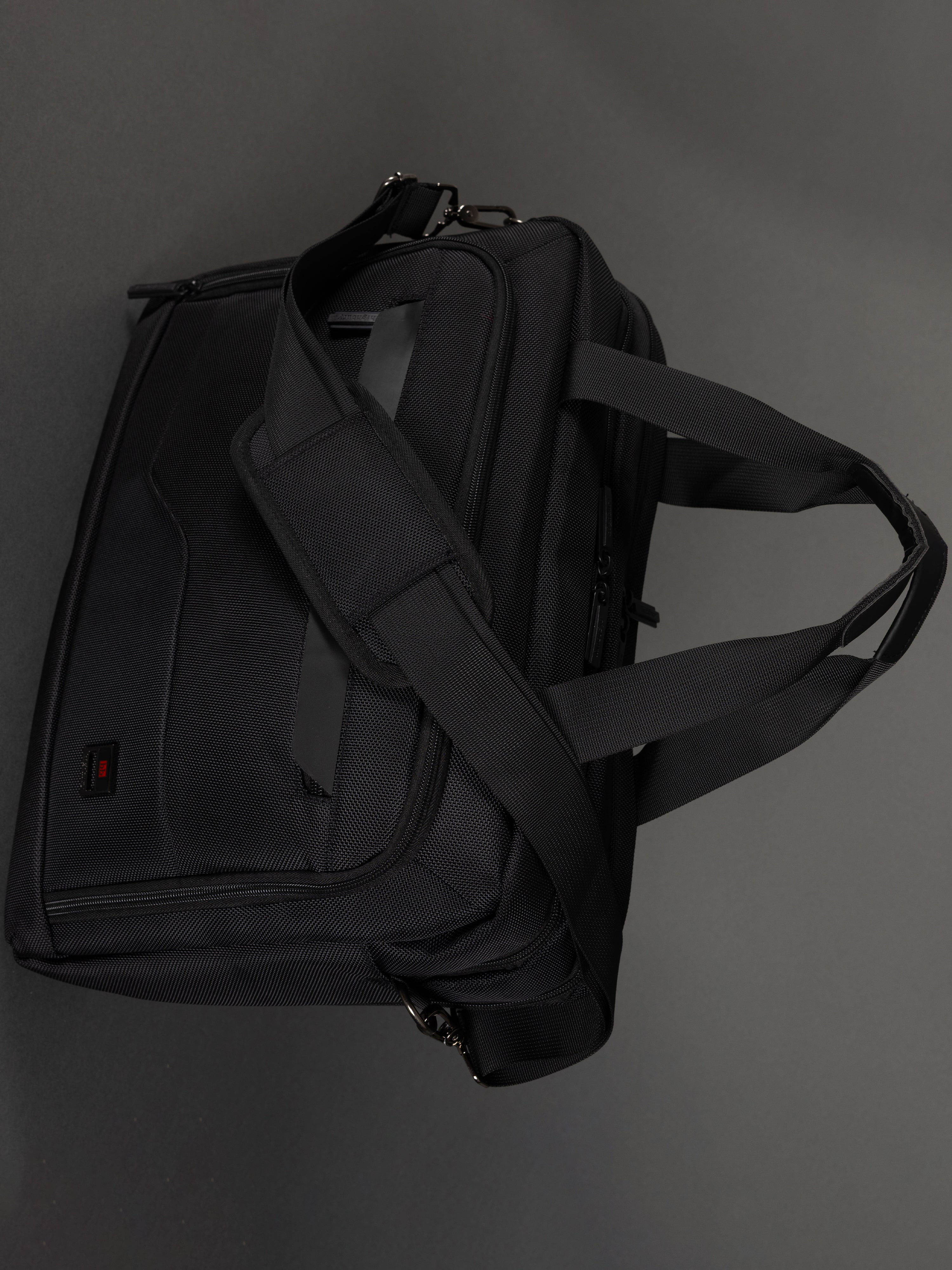 "Durable polyester laptop bag with shoulder strap"