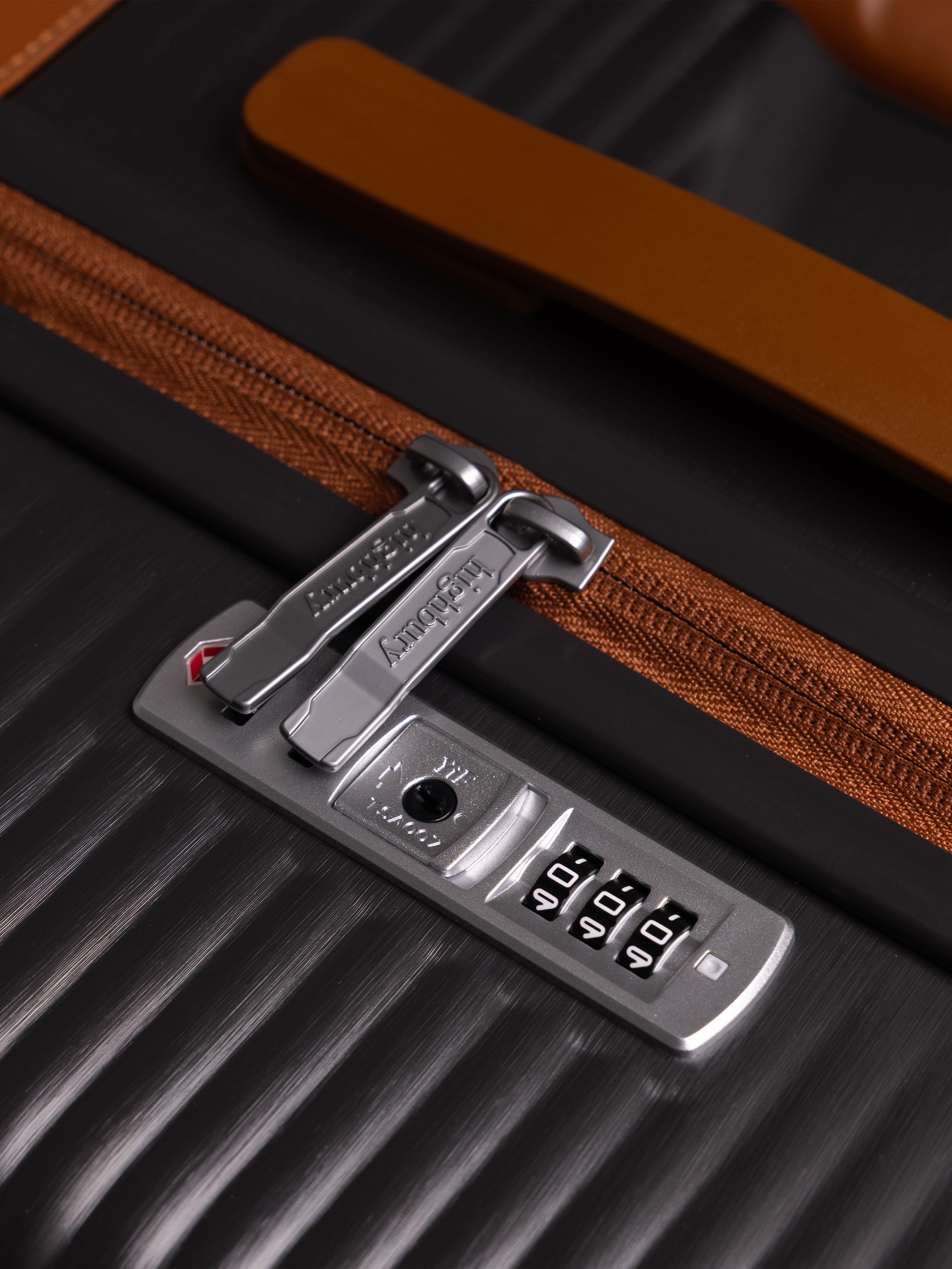 "Dark Grey hard shell suitcase with TSA lock and spinner wheels"