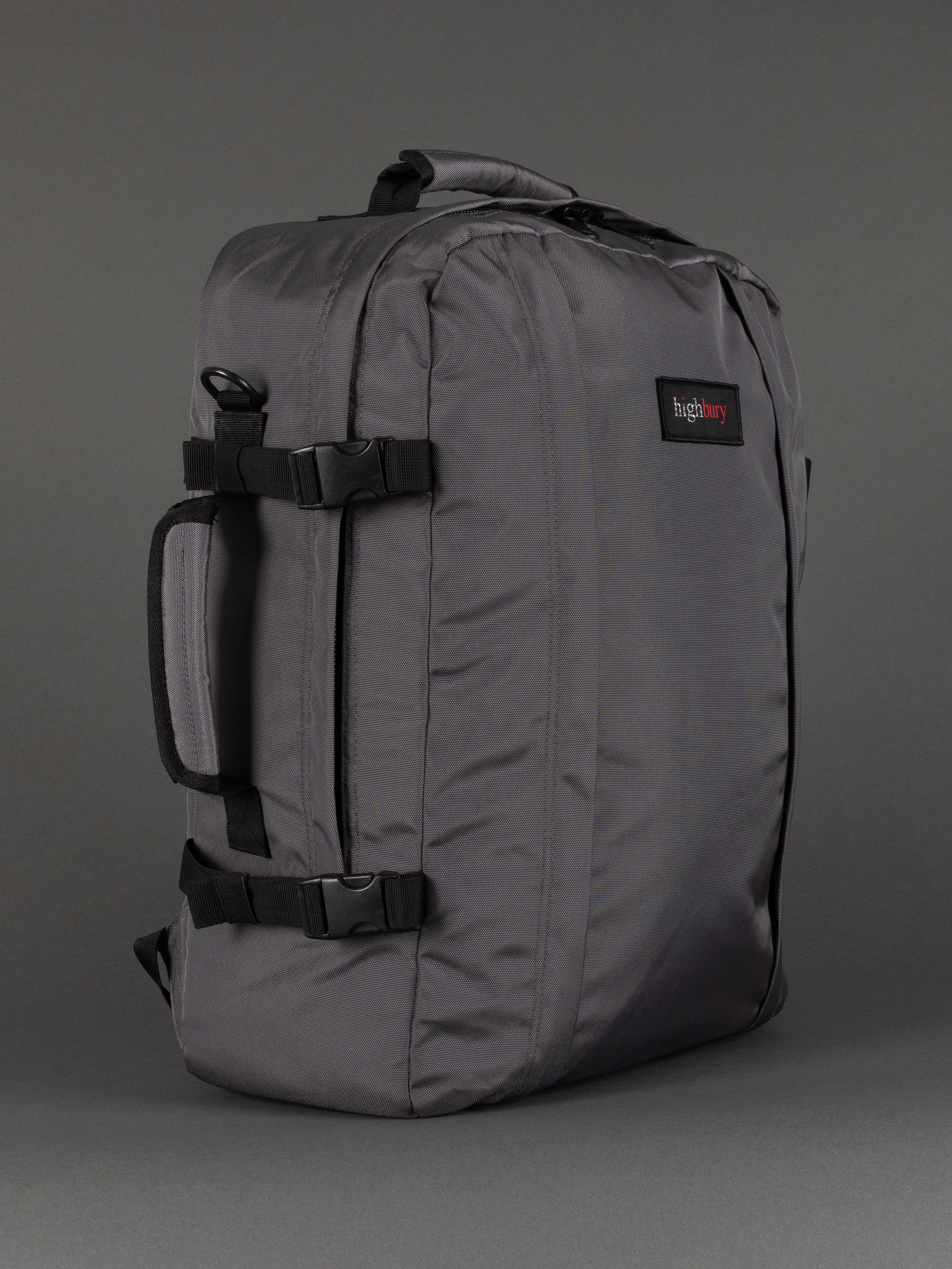 "Grey cabin-size travel backpack with padded laptop compartment"