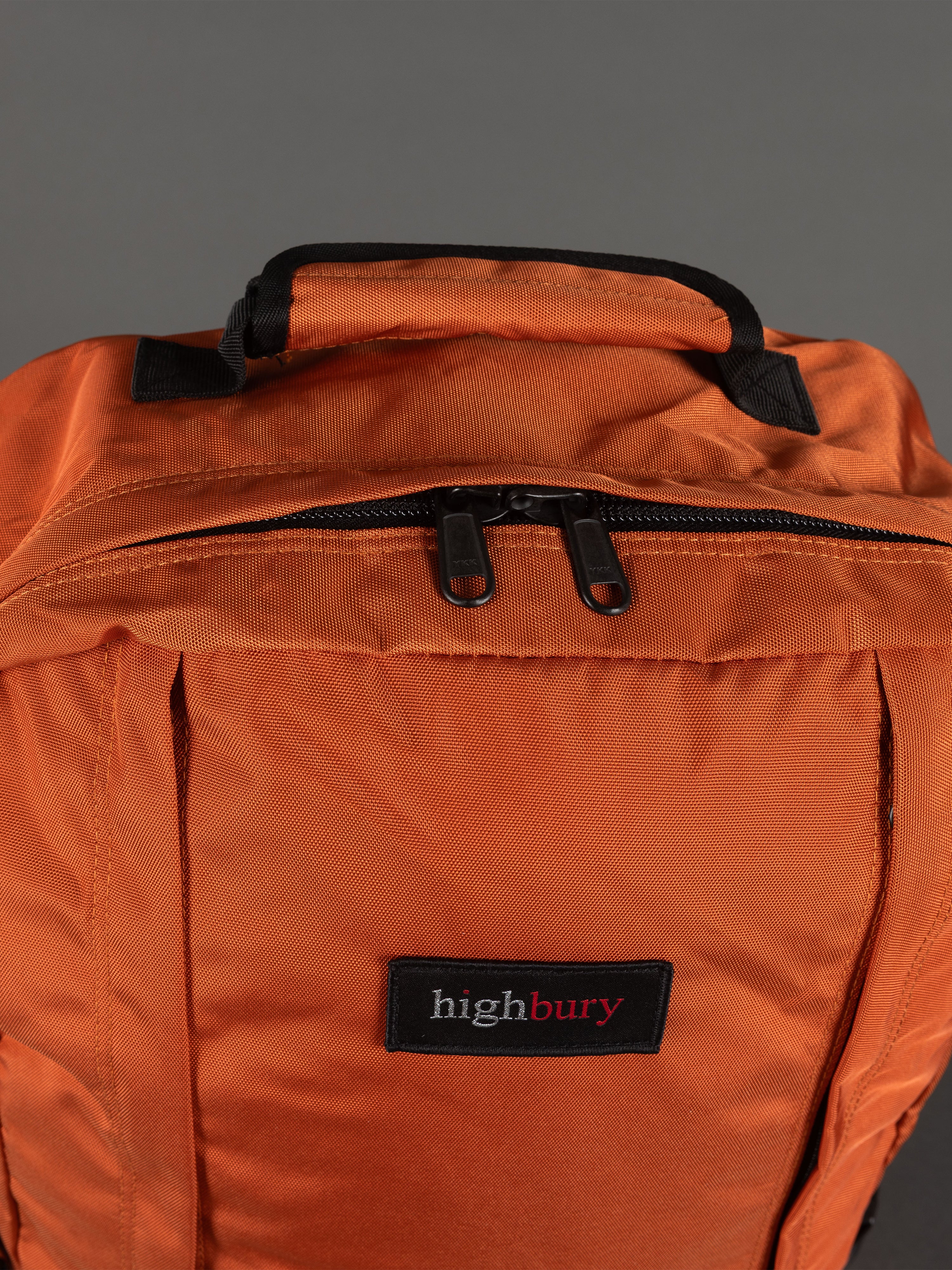 "Durable 1680D polyester cabin backpack in orange"