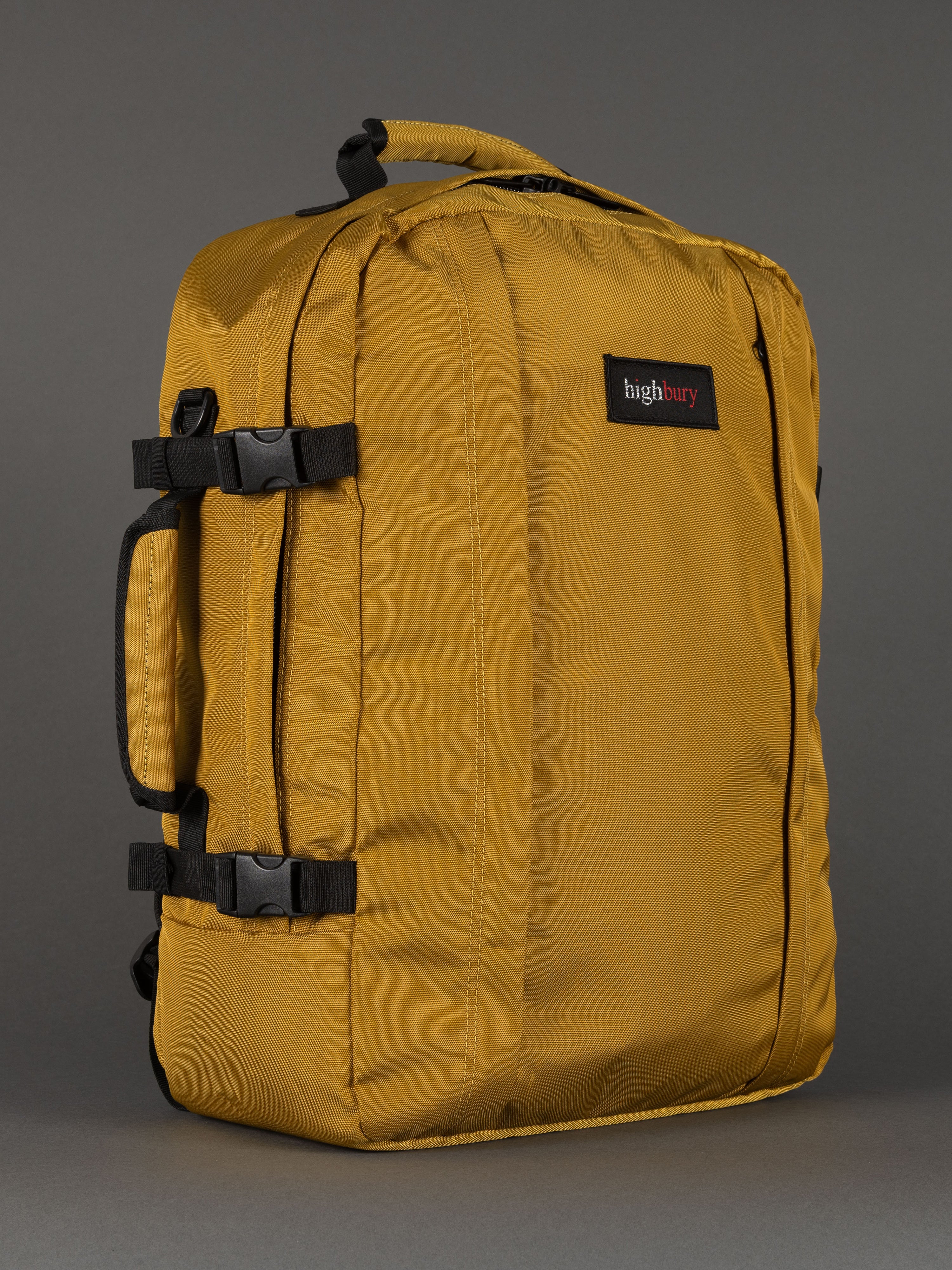 "Yellow cabin-size travel backpack with padded laptop compartment"