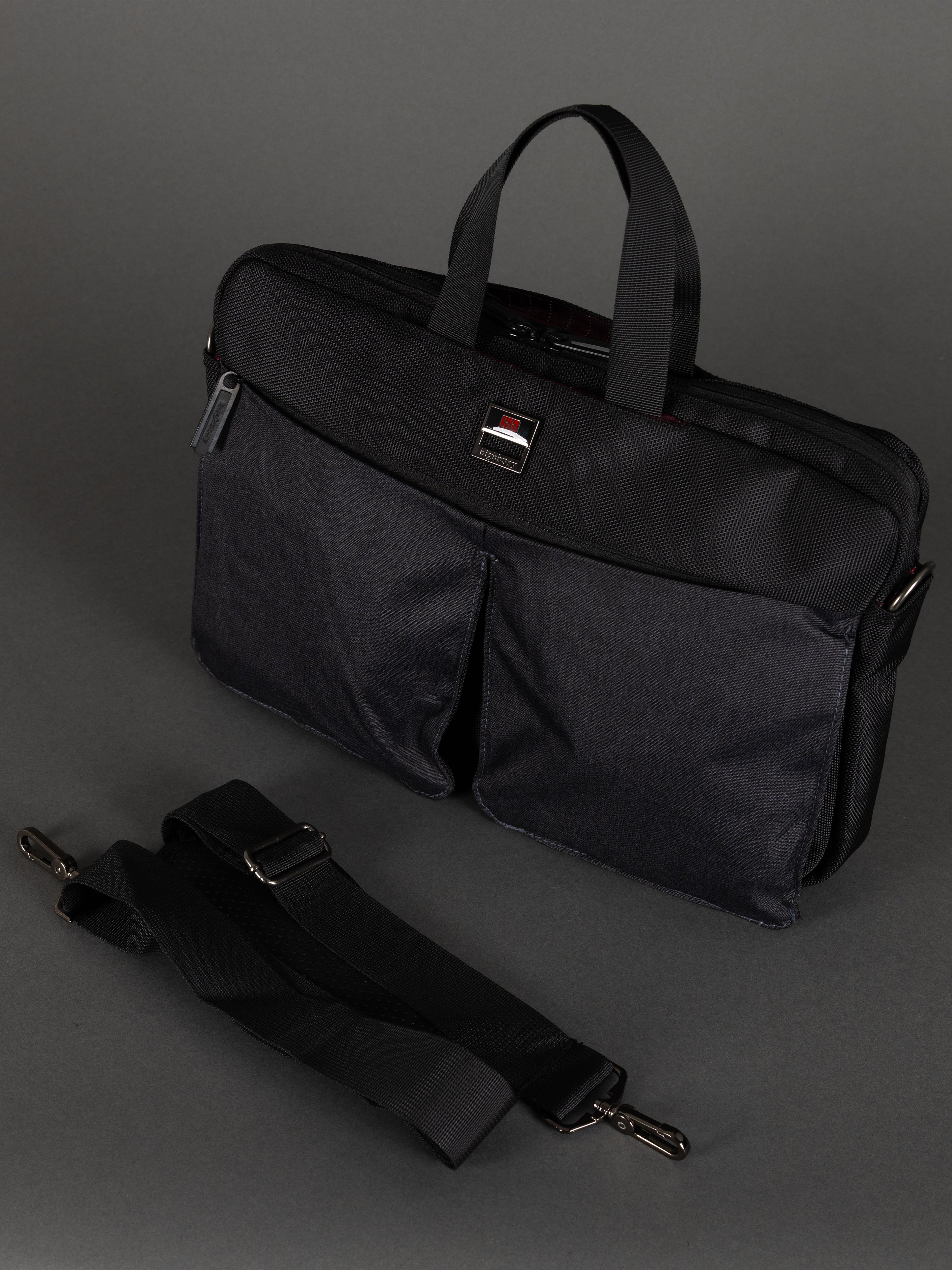 "Slim black laptop bag with padded compartment for A4 documents"
