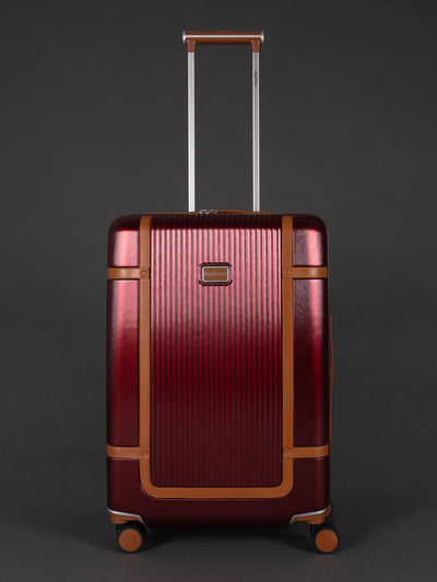 "25 inch medium burgundy hard shell suitcase with TSA lock"