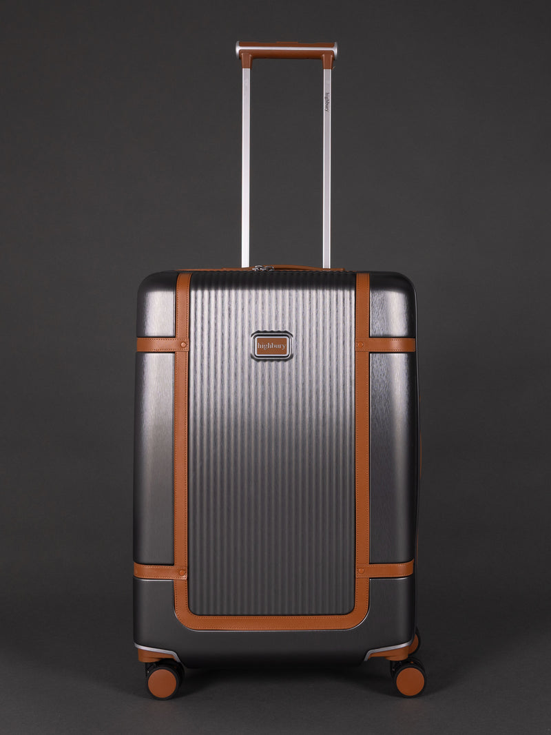 "25 inch medium Dark Grey hard shell suitcase with TSA lock"