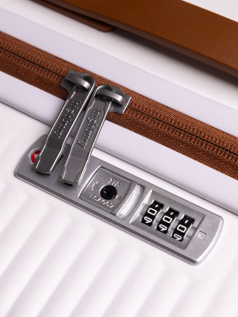 "White hard shell suitcase with TSA lock and spinner wheels"
