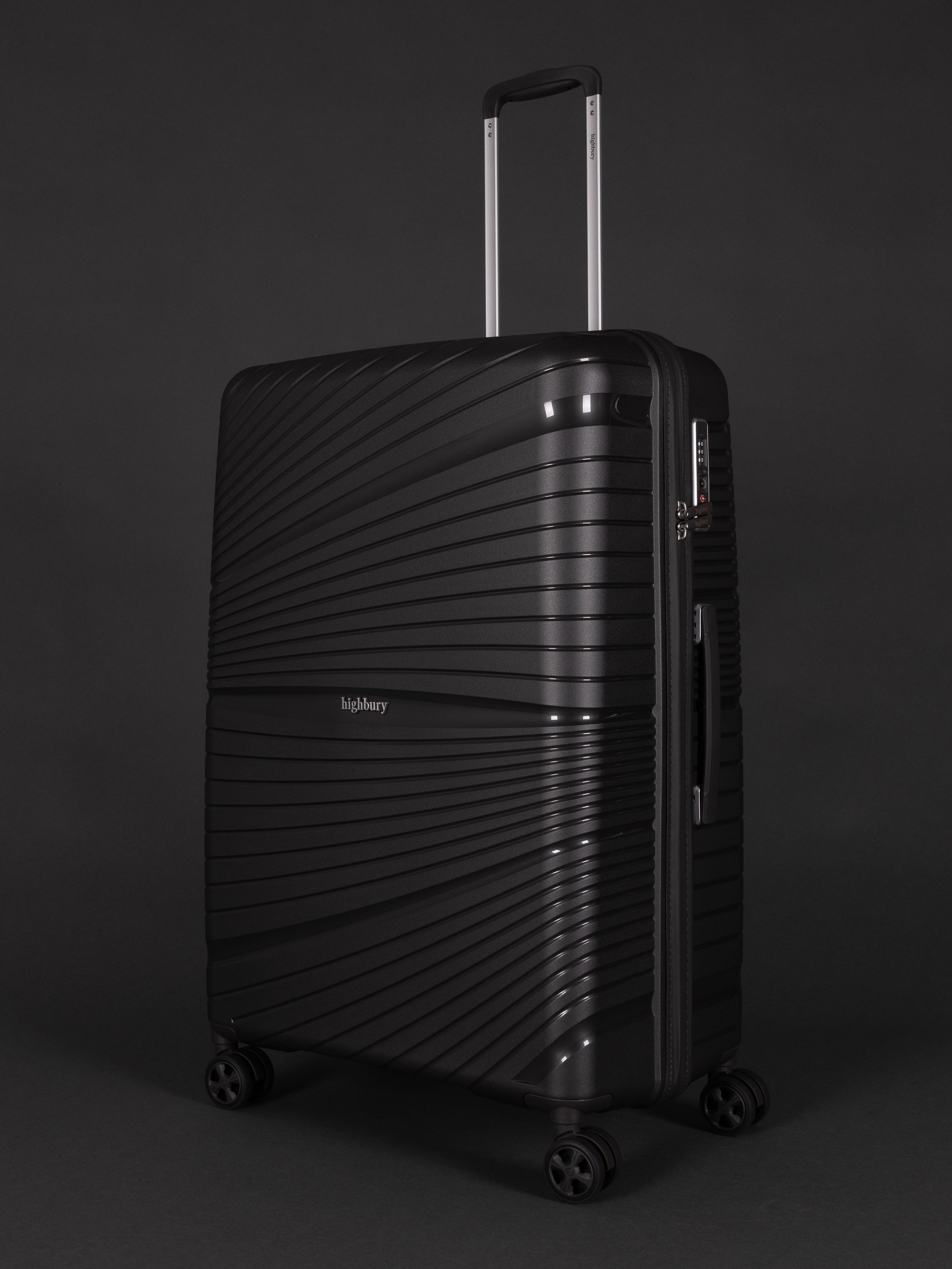 "Highbury Helios 3 piece dark grey luggage set with TSA-approved lock and 10-year warranty"