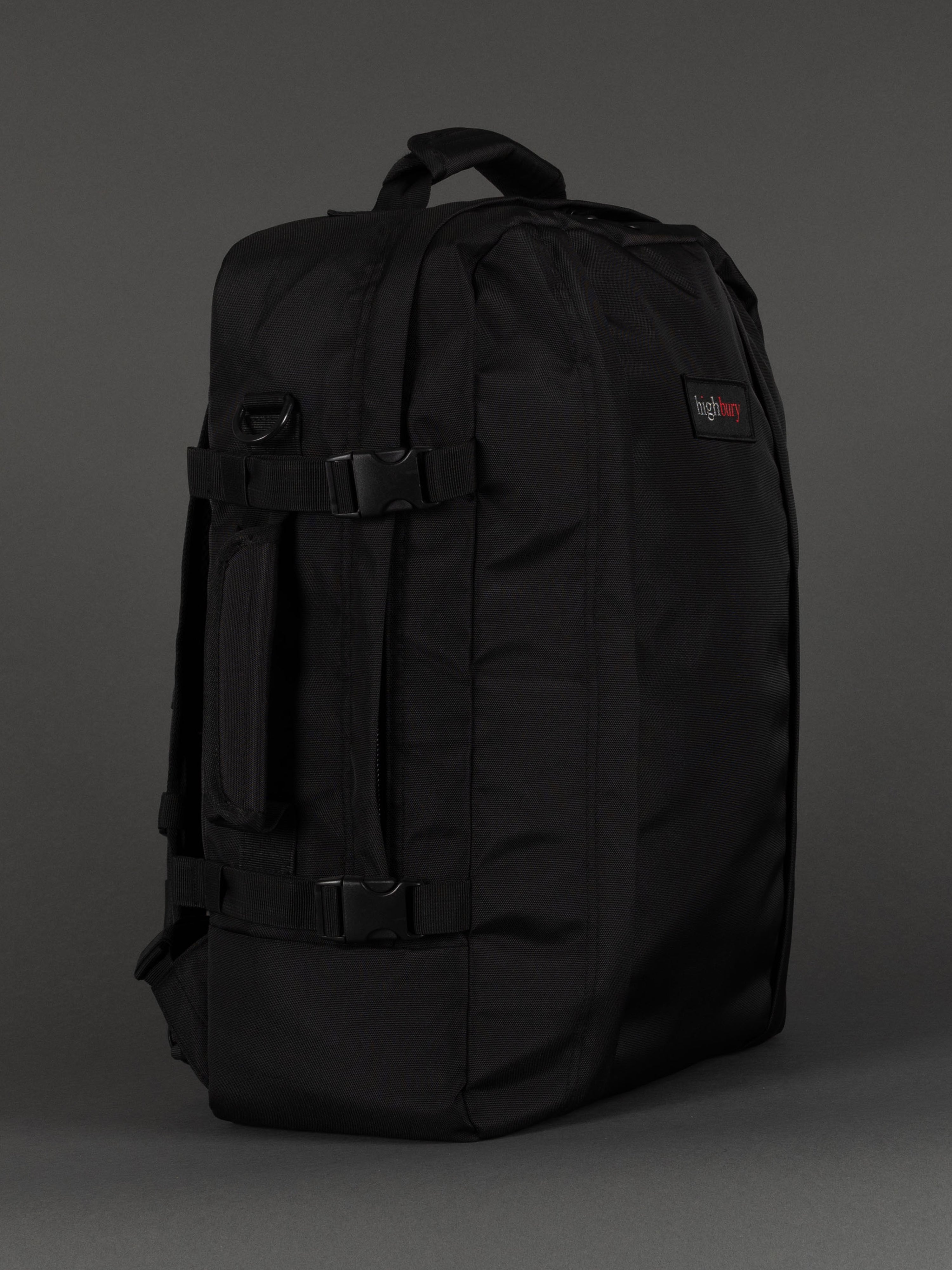 "Black cabin-size travel backpack with padded laptop compartment"