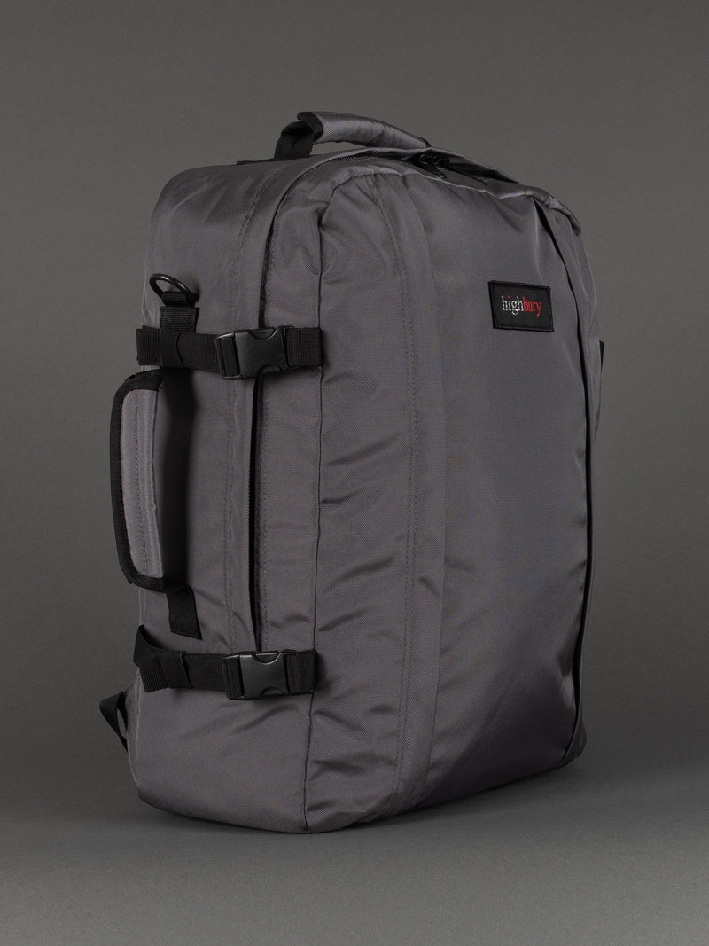 "Grey cabin-size travel backpack with padded laptop compartment"