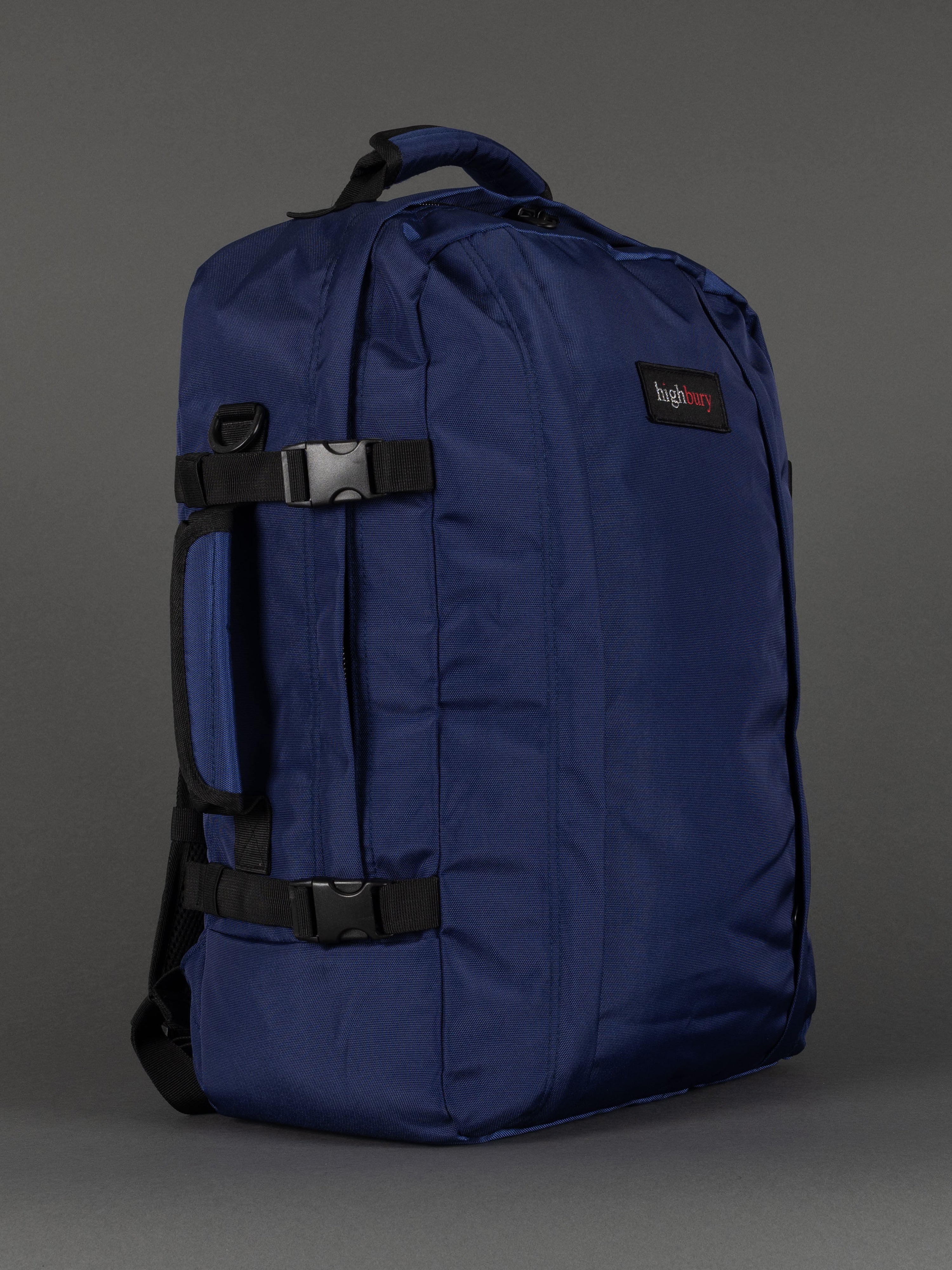 "Navy cabin-size travel backpack with padded laptop compartment"