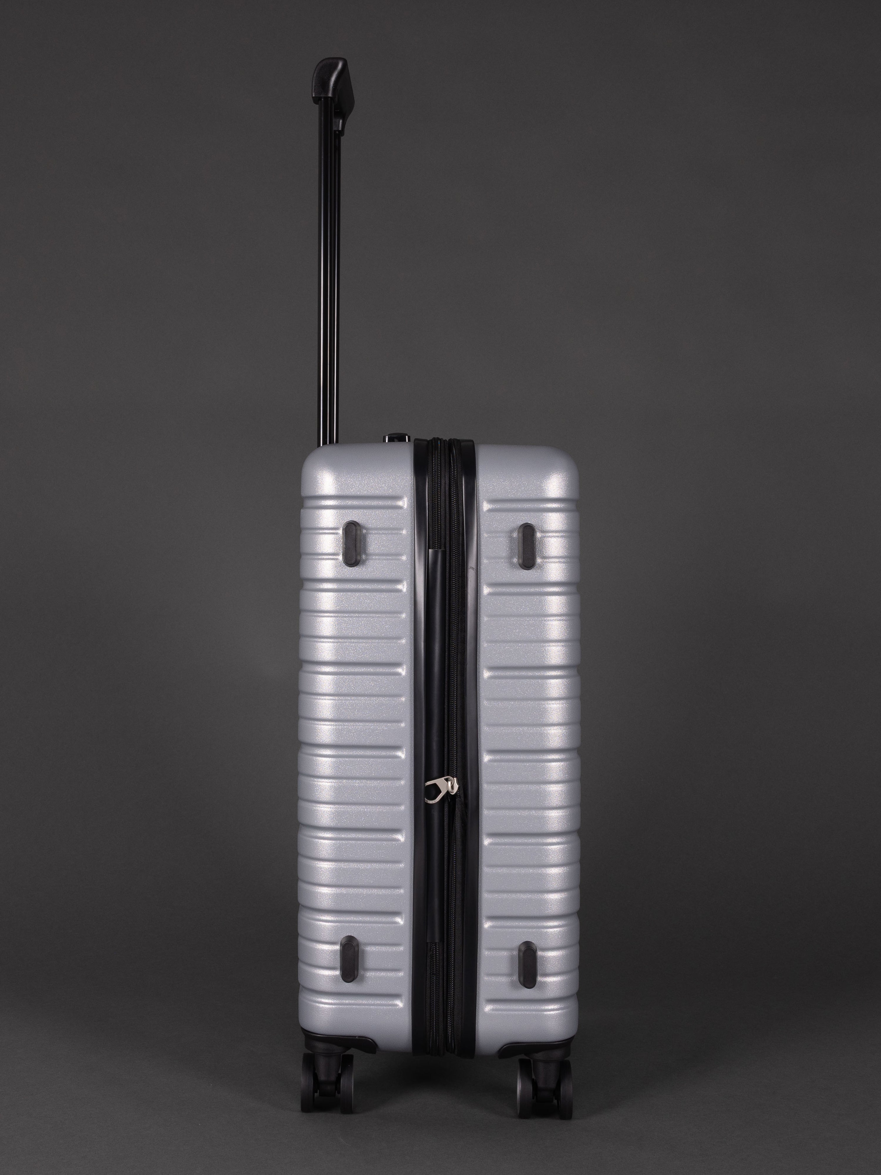 “Side view of expandable BEOW luggage showing 20% additional storage capacity”