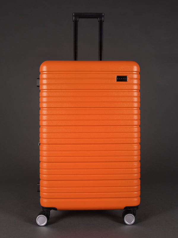 “Bright orange spinner wheel suitcase set – durable hard shell”