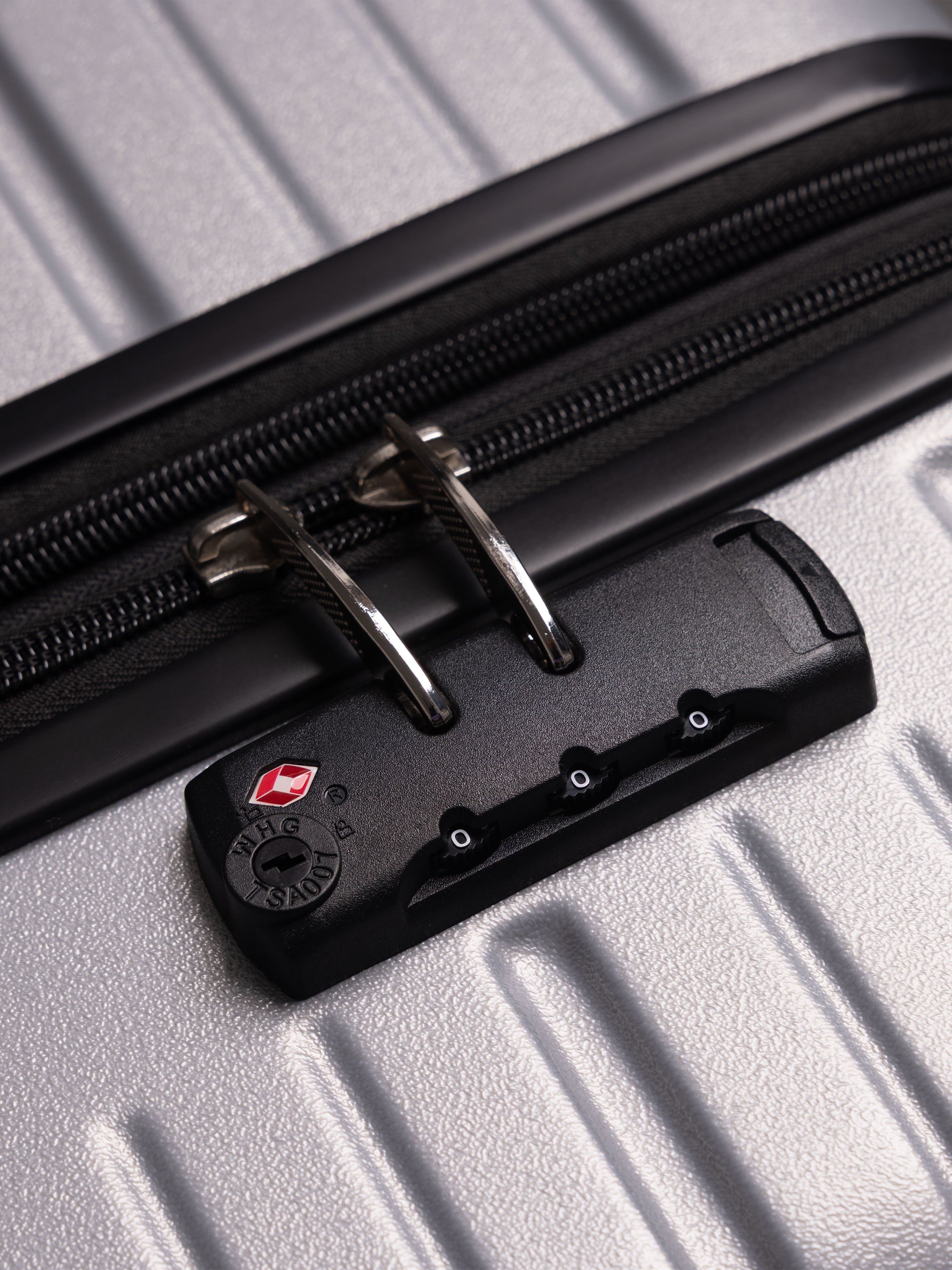 “Close-up of TSA lock on BEOW 3 piece luggage set for secure international travel”