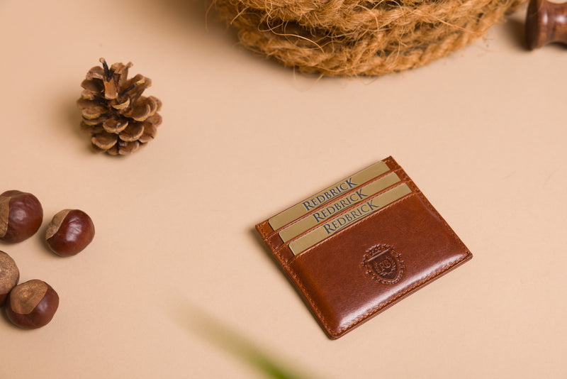 "Cognac leather card holder with engraved initials"
