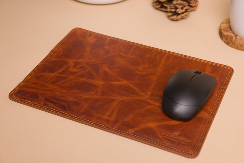 "Smooth tan mouse pad with suede non-slip backing"
